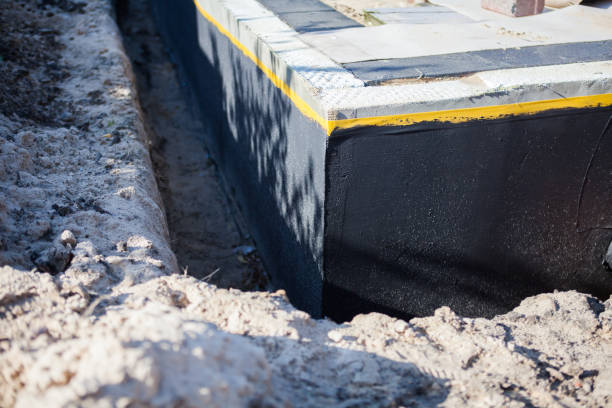 Professional Waterproofing technician working in Monon, IN